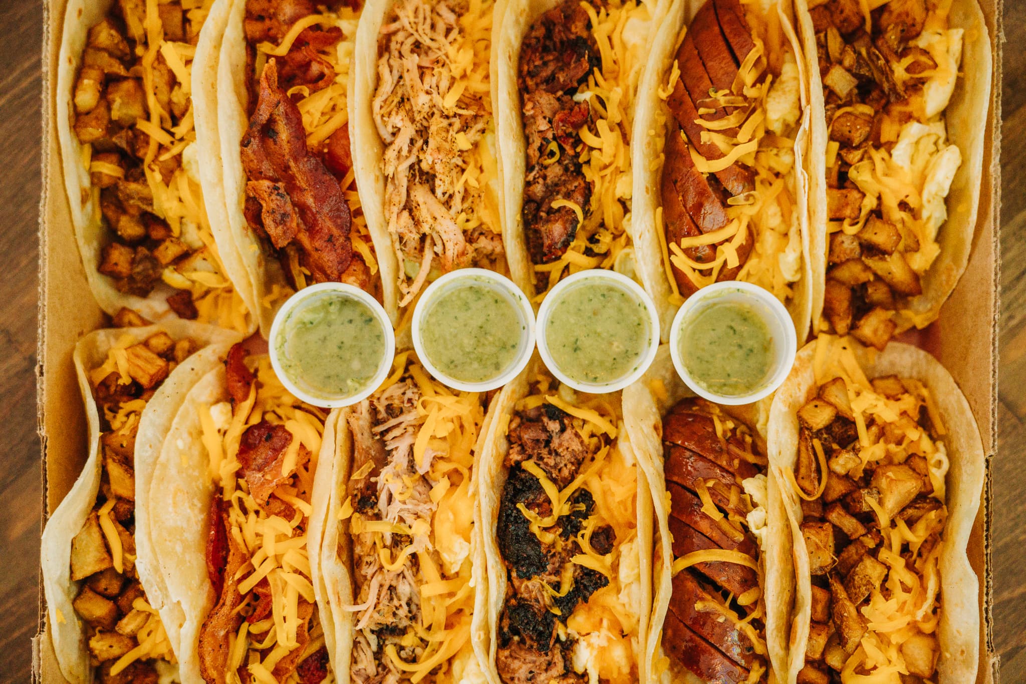 Breakfast taco box with green salsa