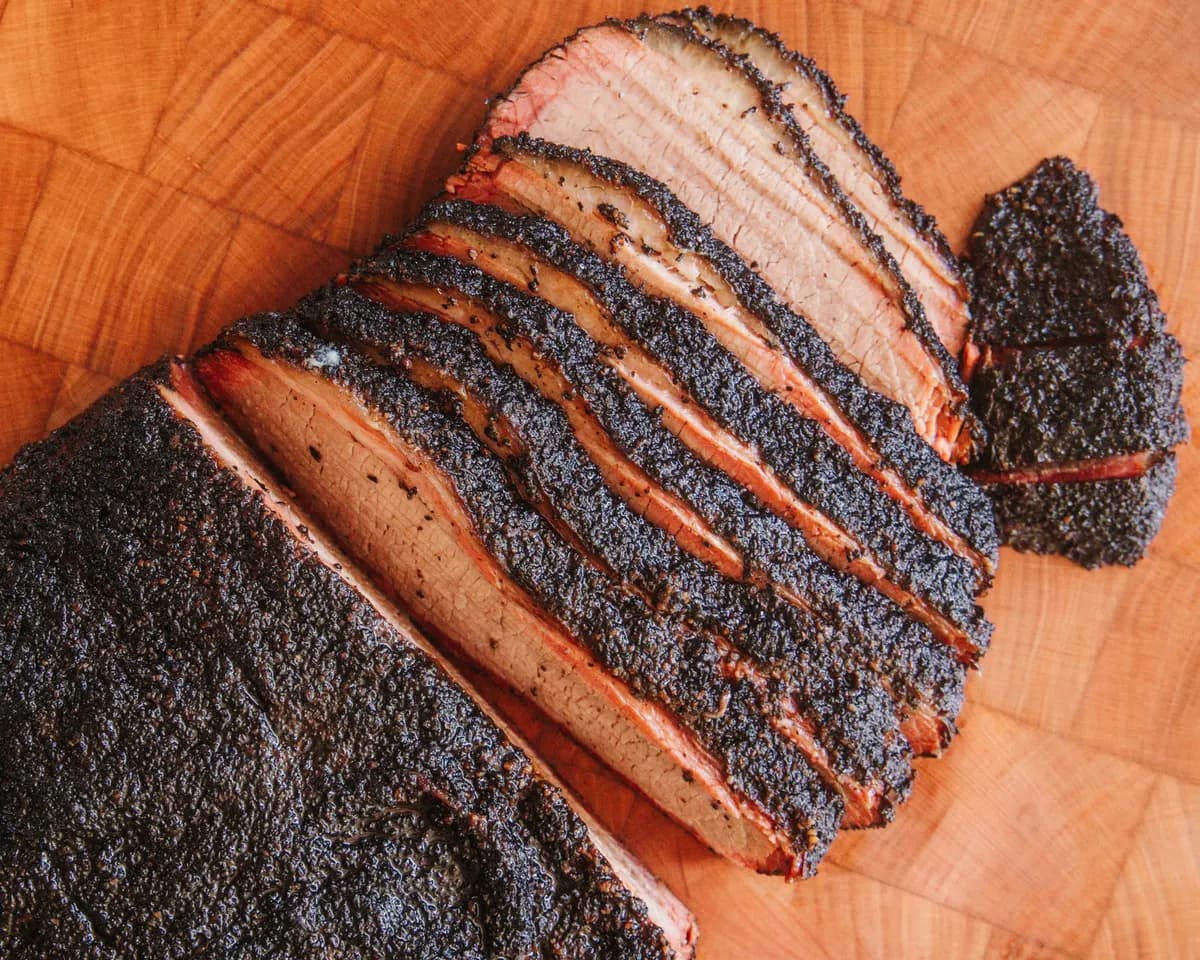 Sliced smoked brisket with a dark bark